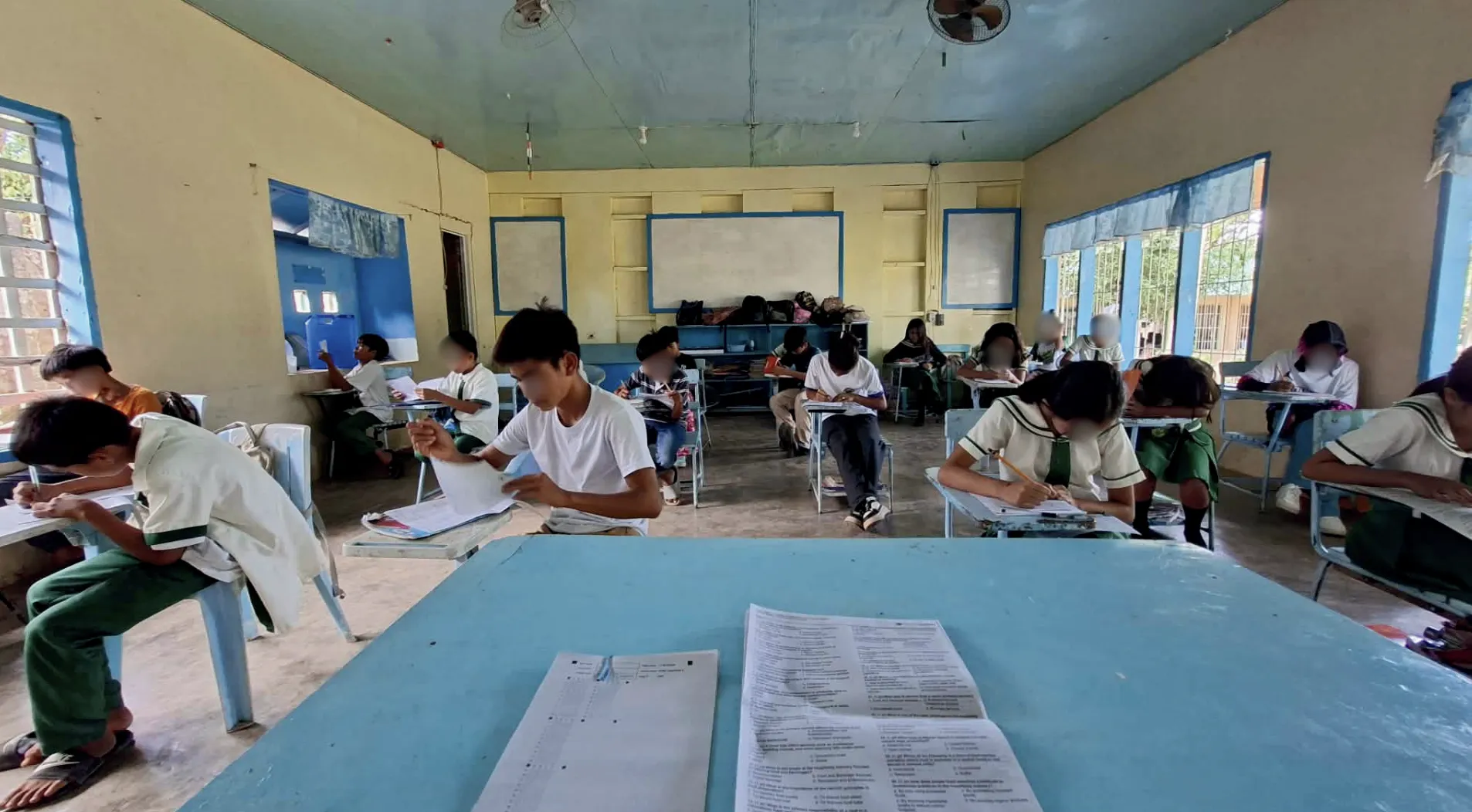 Students answering GradeChum answer sheets in a DepEd classroom